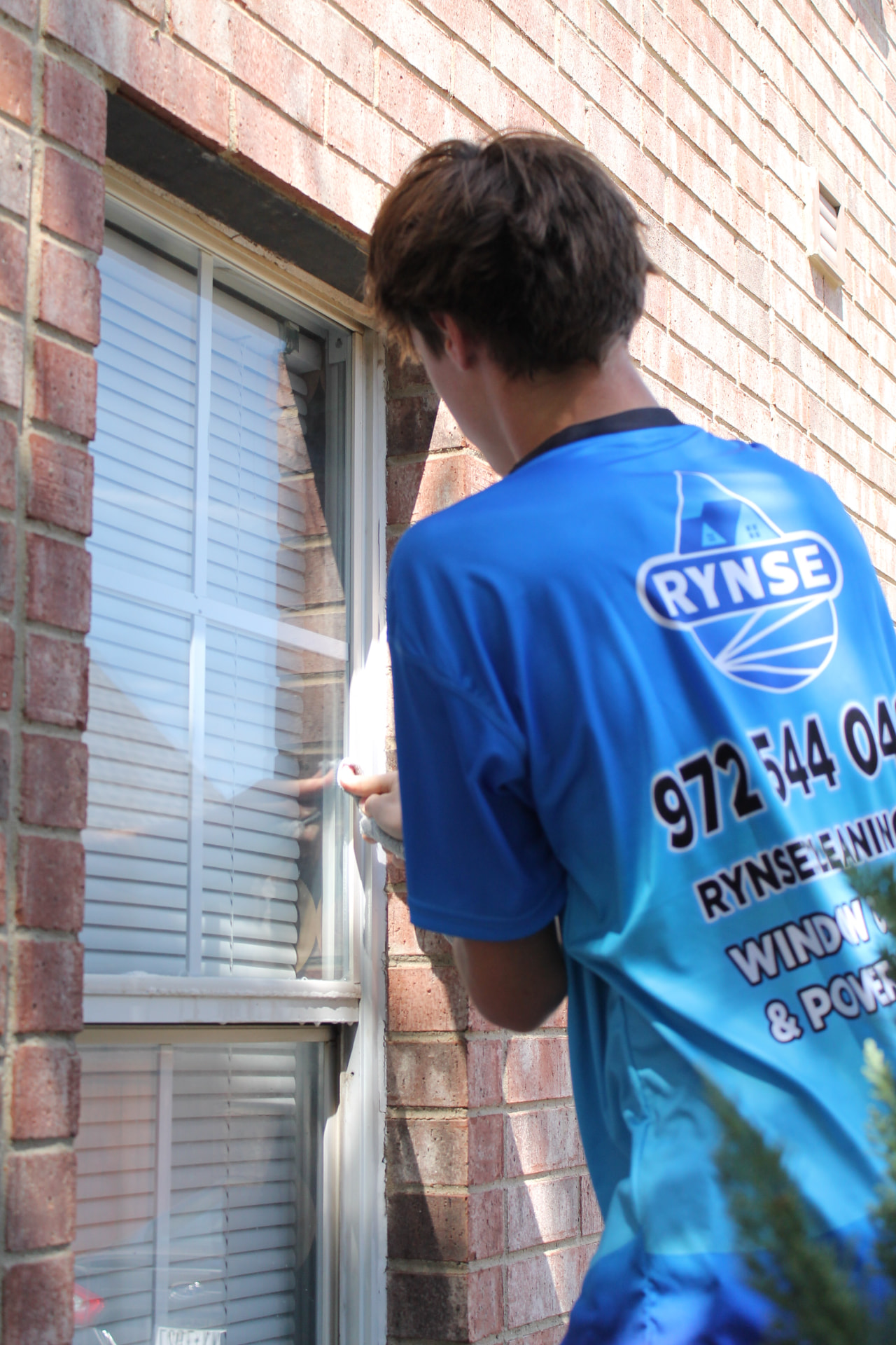 RYNSE technician detailing a residential window